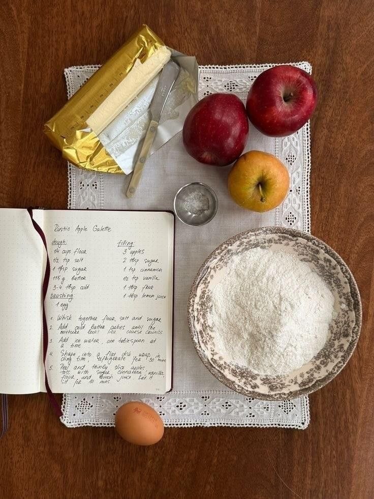 Recipe notebook with apples, flour and butter